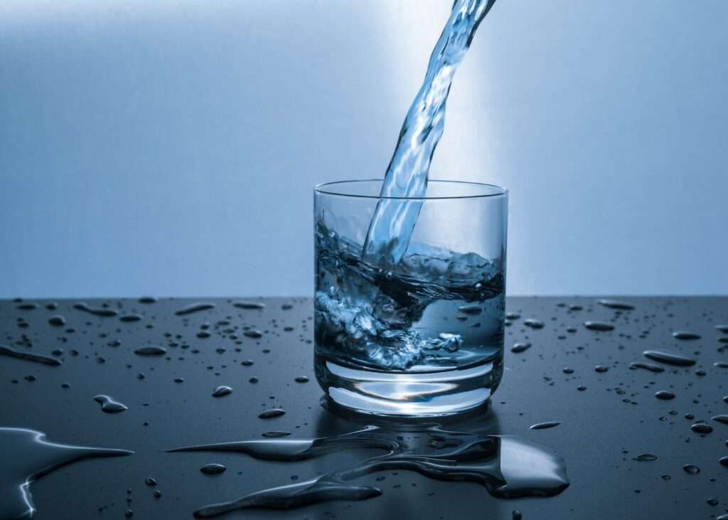 pouring water in a glass