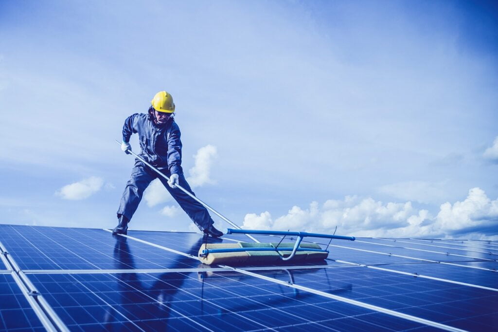 man rooftop cleaning