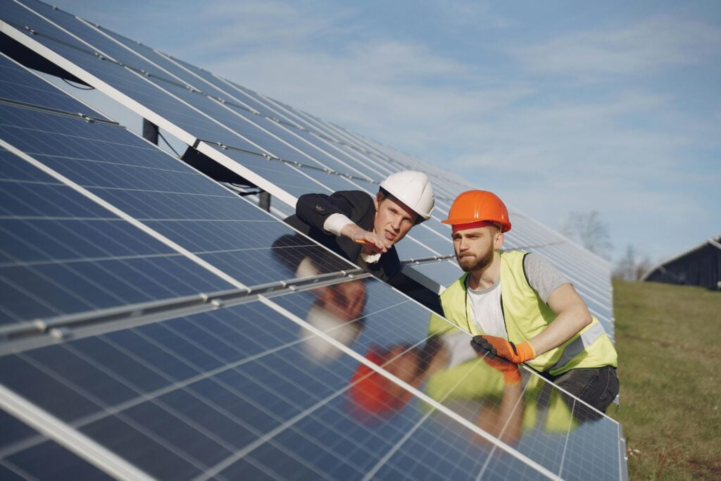 men on solar panels